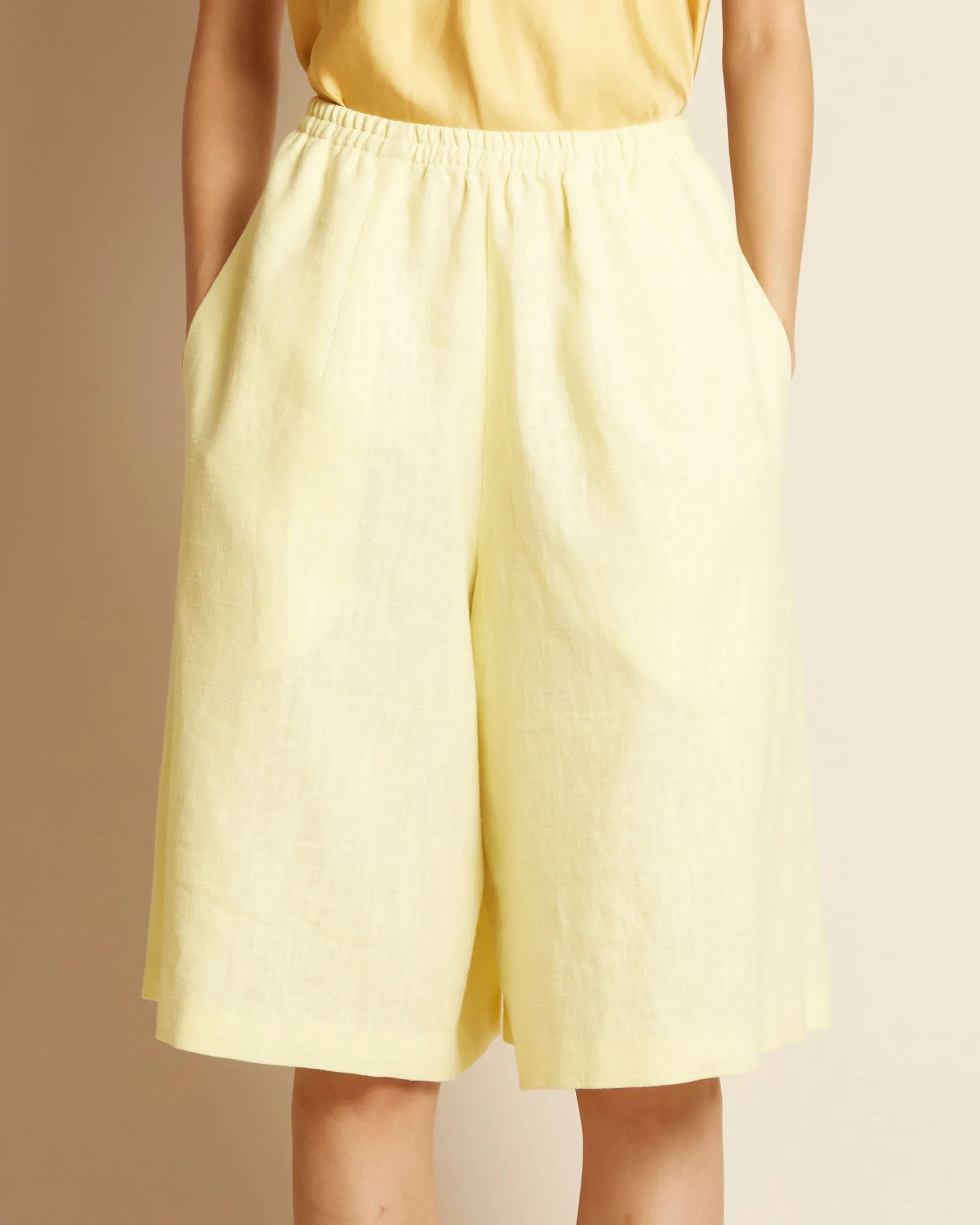 Sand Pleated Knee-High Shorts w/ Elastic in Light Yellow